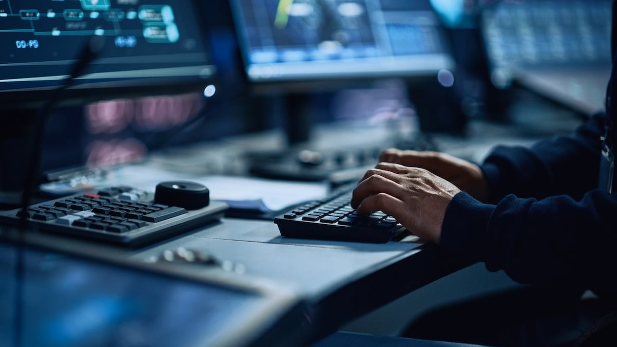An IT security employee works at his workstation, showing a step-by-step path to pilot, govern, integrate, and scale AI agents.An IT security employee works at his workstation, showing a step-by-step path to pilot, govern, integrate, and scale AI agents.