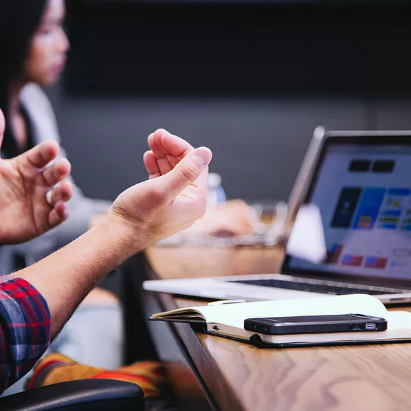 An employee is seen on a Microsoft Teams call, seamlessly accessing and pulling team files from a SharePoint Online dashboard, enabling real-time collaboration and ensuring everyone stays aligned and productive.