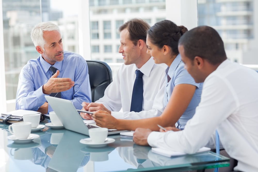 Employees using devices that are secured using Arctic Wolf to meet and discuss business