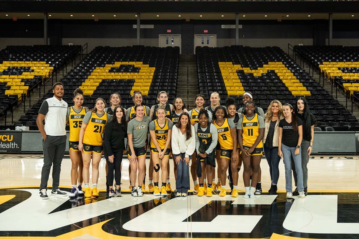 Picture of Synergy Technical Community Outreach Program team with VCU Women's Basketball.