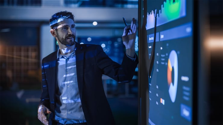A CISO presents AI agent security risks to a team, emphasizing Zero Trust controls for non-human identities.