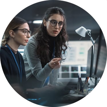 Focused on a shared screen, the IT duo uses Intune EAM to push critical updates across hundreds of endpoints in just minutes.