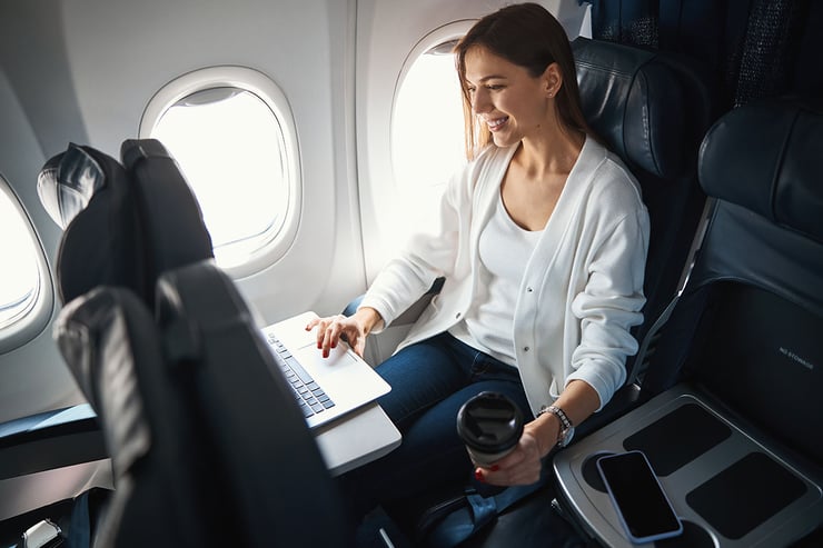 Picture of employee accessing business data remotely while on a business trip and harnessing the power of AI safely and securely with Microsoft 365 Copilot