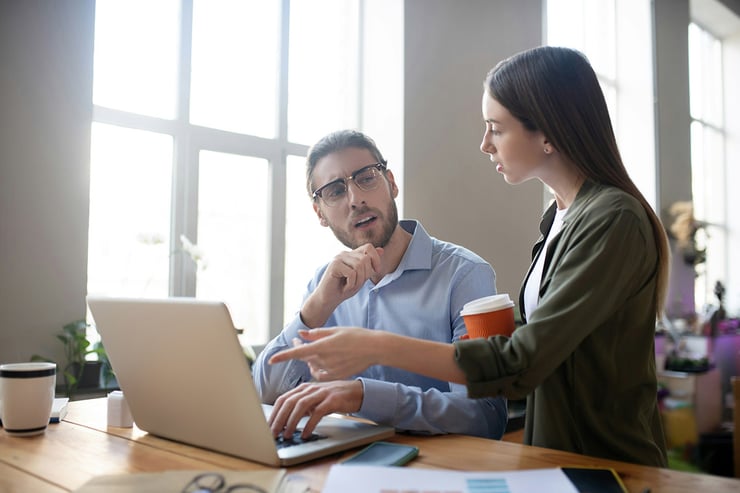 Two IT leaders meeting to discuss how converting to Microsoft CSP gives their organization greater control, flexibility, and faster support