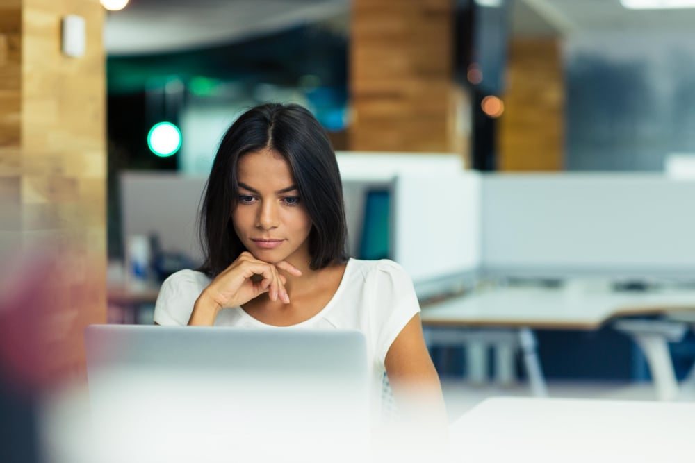 Portrait of a businesswoman using laptop in office