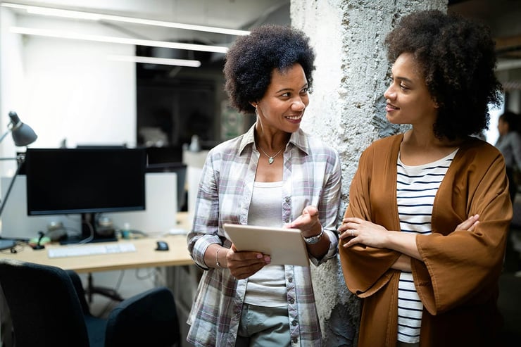 Two employees review their AI strategy and realize that starting with a small anchor project helps them deliver quick wins, prove value, and scale confidently.