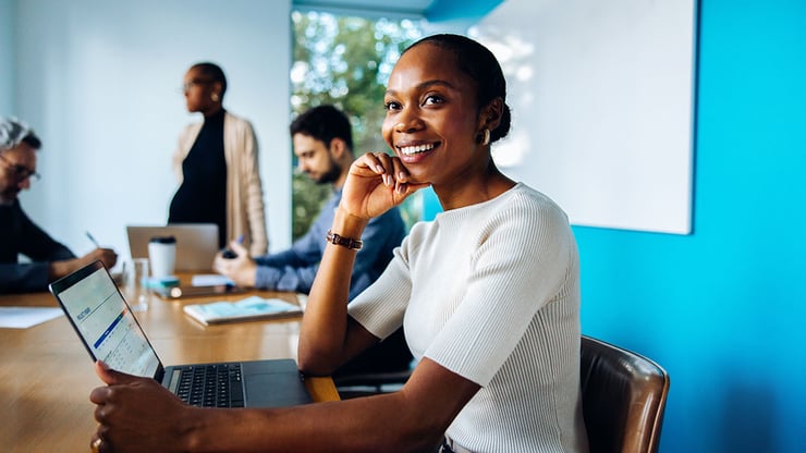 An employee confidently leads a meeting after using Microsoft Copilot Cowork to gather information, organize research, and prepare recommendations.
