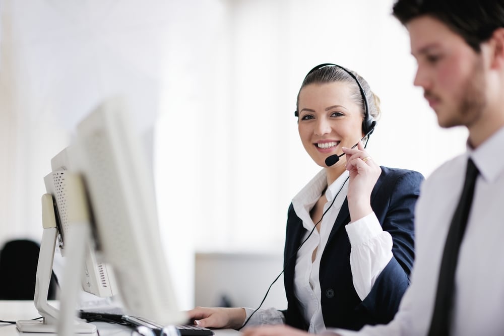 business people group with headphones giving support in help desk office to customers