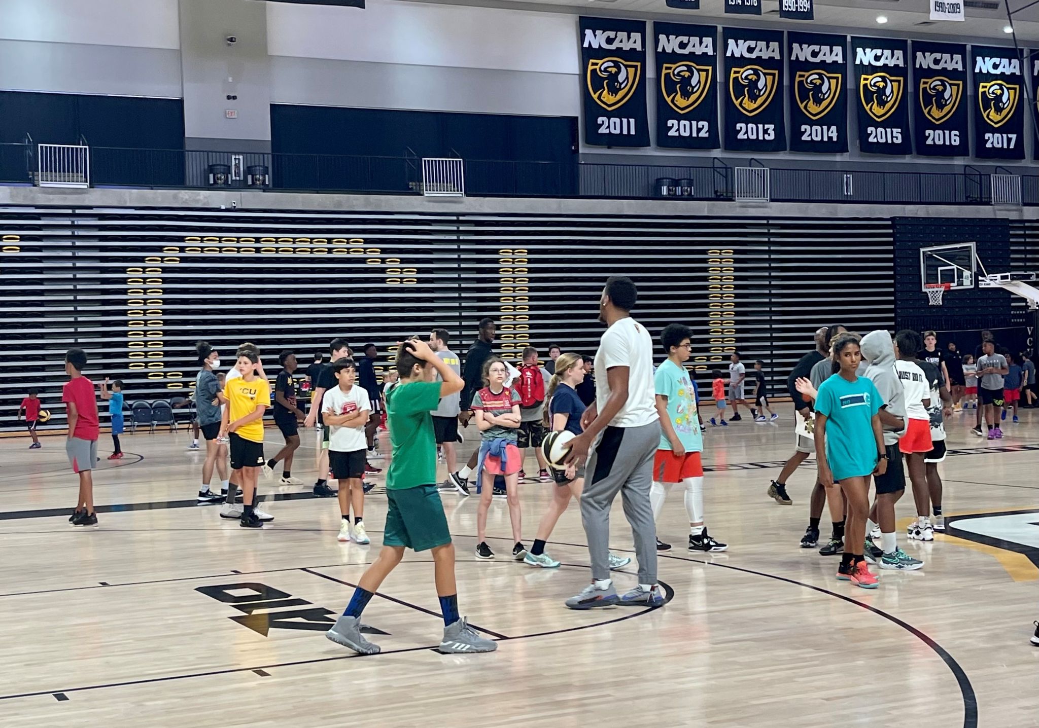 Picture showing kids at the Mike Rhoades Basketball Camp