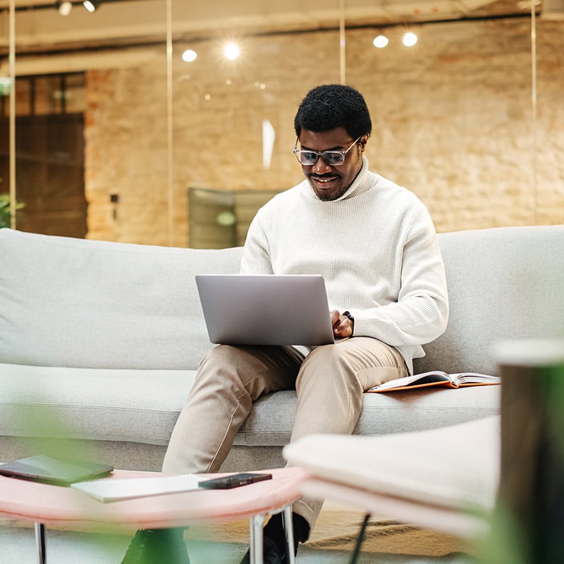 A male employee stays productive whether he is in the office, at home, or traveling because Azure Virtual Desktop gives him secure access to organization applications and a familiar Windows experience from virtually anywhere.