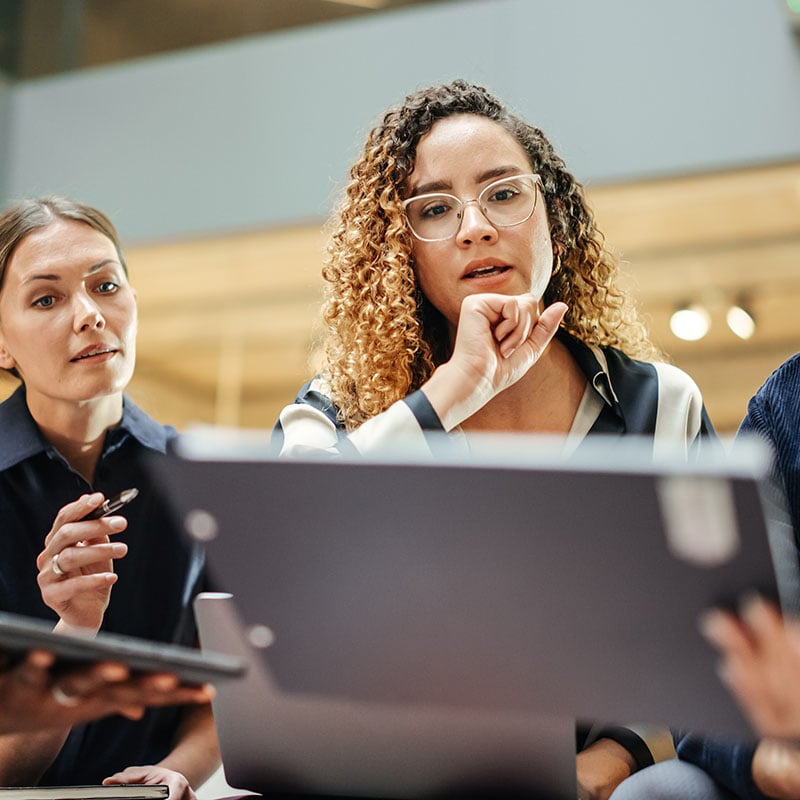 A male employee works smoothly from his laptop using Azure Virtual Desktop, which helps him access the tools he needs while the organization keeps desktops, policies, and access controls more centralized.