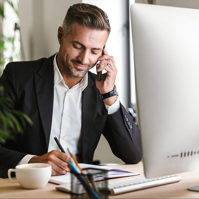 Picture of employee working from home knowing that his workloads are secure