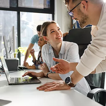 An HR employee and her manager use SharePoint to curate and share essential company resources, such as handbooks and onboarding materials, while posting updates and announcements to keep employees informed and connected.