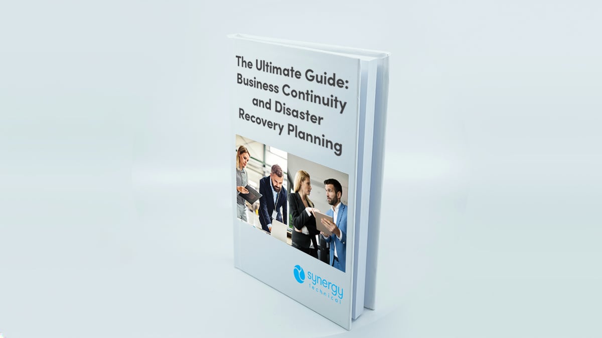 A digital booklet titled The Ultimate Guide: Business Continuity and Disaster Recovery displayed on a screen, symbolizing expert guidance and strategic planning resources.