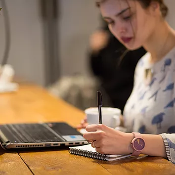 Girl Working in a Cafe