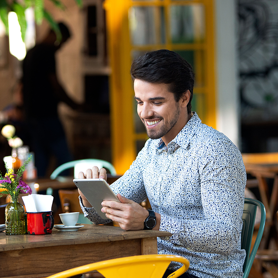 Picture of employee using a tablet to get on Microsoft Teams and chat, call, and join meetings with the team