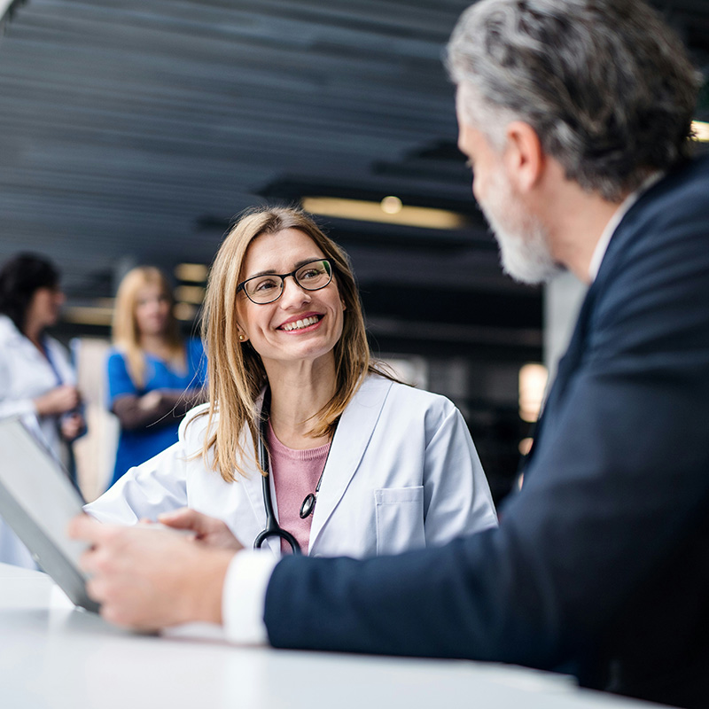 A nurse in a hospital updates patient charts on her desktop with confidence, knowing the managed IT services provider keeps systems secure and available.
