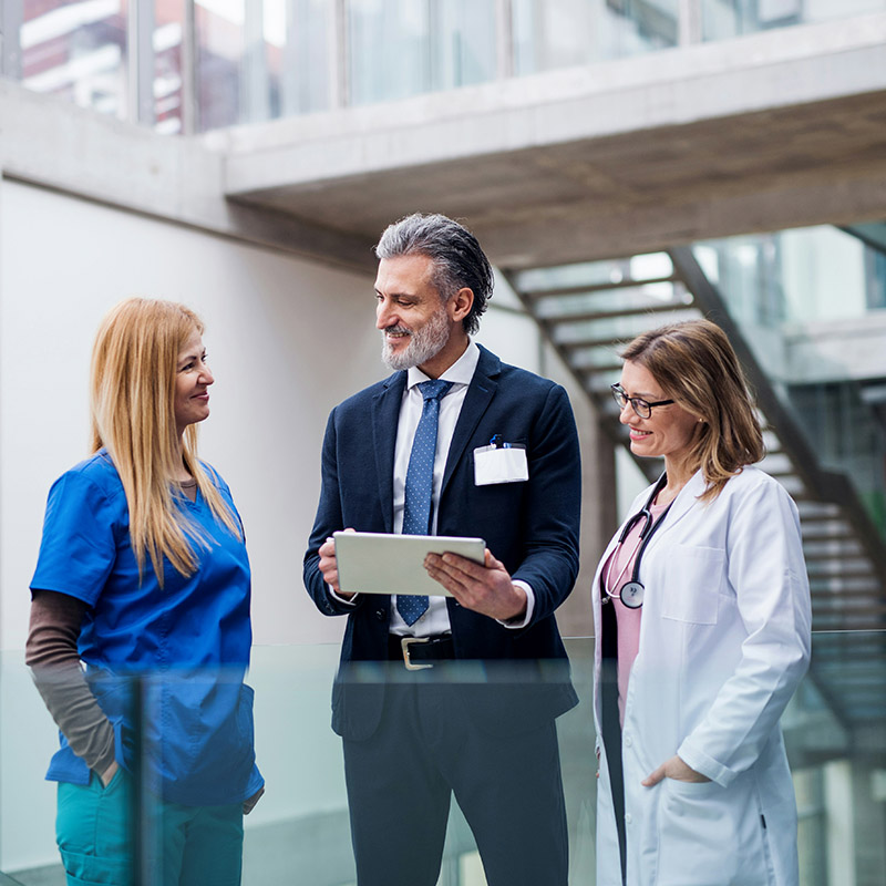 A hospital nurse accesses electronic health records quickly during her shift, supported by the managed IT services provider that ensures uptime and data security.