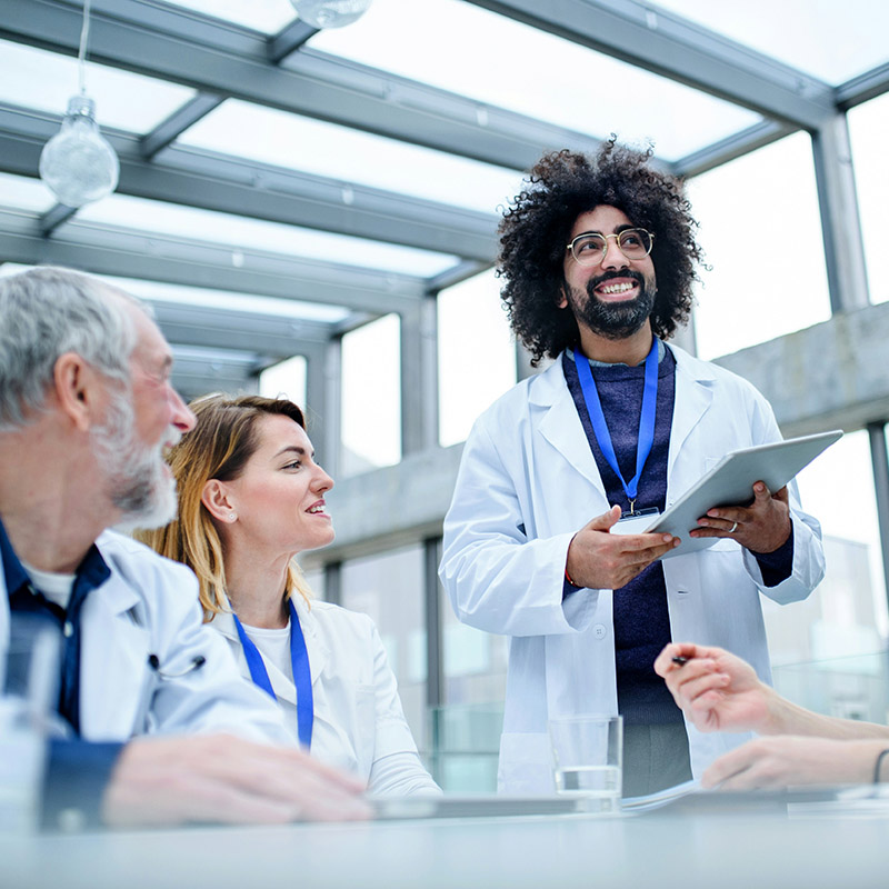 An internal IT staff member focuses on implementing a new clinical app while the managed IT services provider handles routine monitoring and cybersecurity.