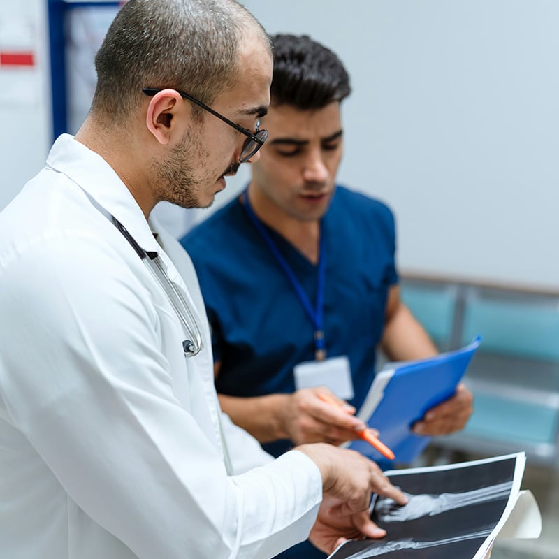 In a diagnostic lab, a technician uploads test results seamlessly thanks to the MSP’s infrastructure management that keeps data flowing between devices and records.