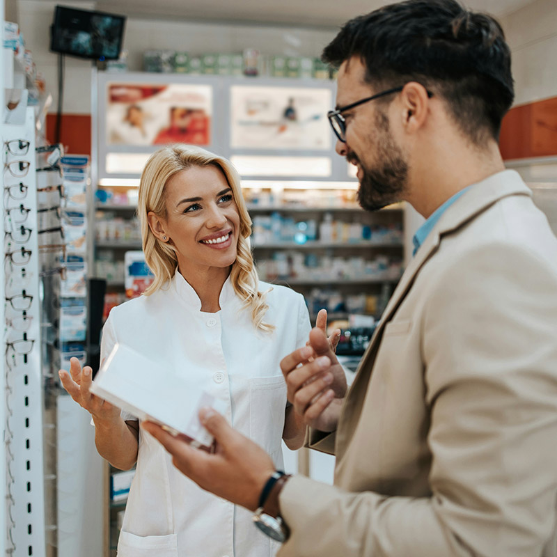 An eyewear shop employee assists a customer in finding the right glasses, enabled by managed IT services that keep point-of-sale and customer systems seamless.