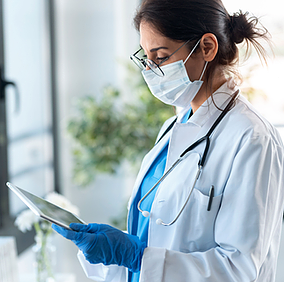 A physician in a clinic leverages Power Automate to automate AI-driven data analysis, eliminating repetitive tasks, integrating multiple data sources, and accelerating decision-making for improved patient outcomes.