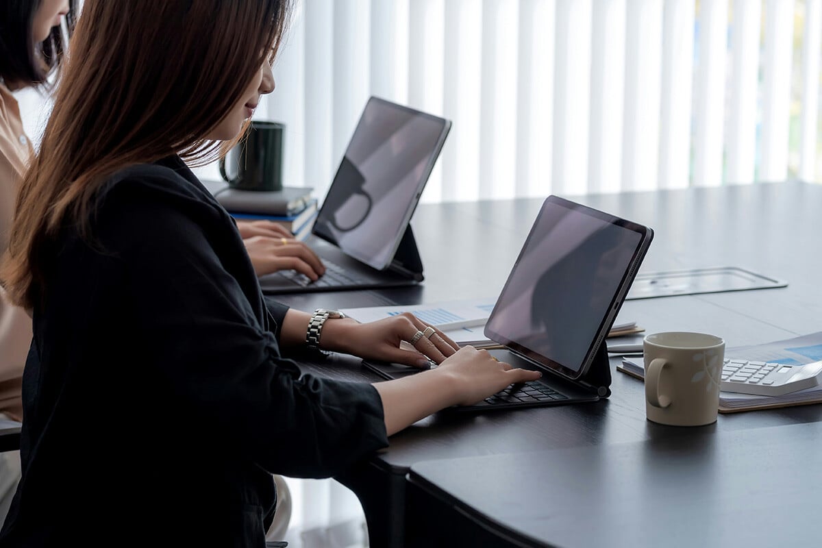 A financial analyst uses Microsoft 365 tools like Excel and Teams to analyze sensitive data with charts and graphs, supported by the effective configuration of security settings across the Microsoft 365 environment.