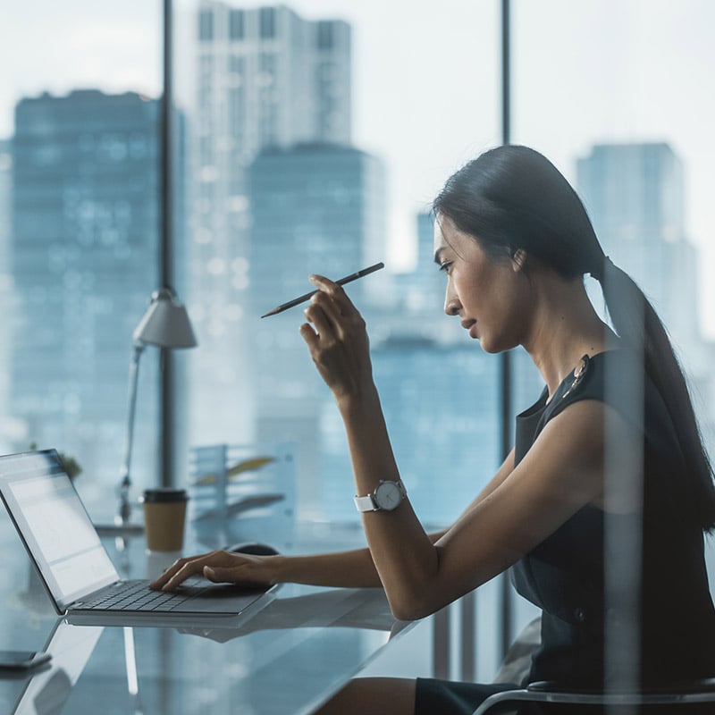 Working from the office, she stays productive on a secure, fully managed device—one of thousands centrally maintained through Microsoft Configuration Manager.