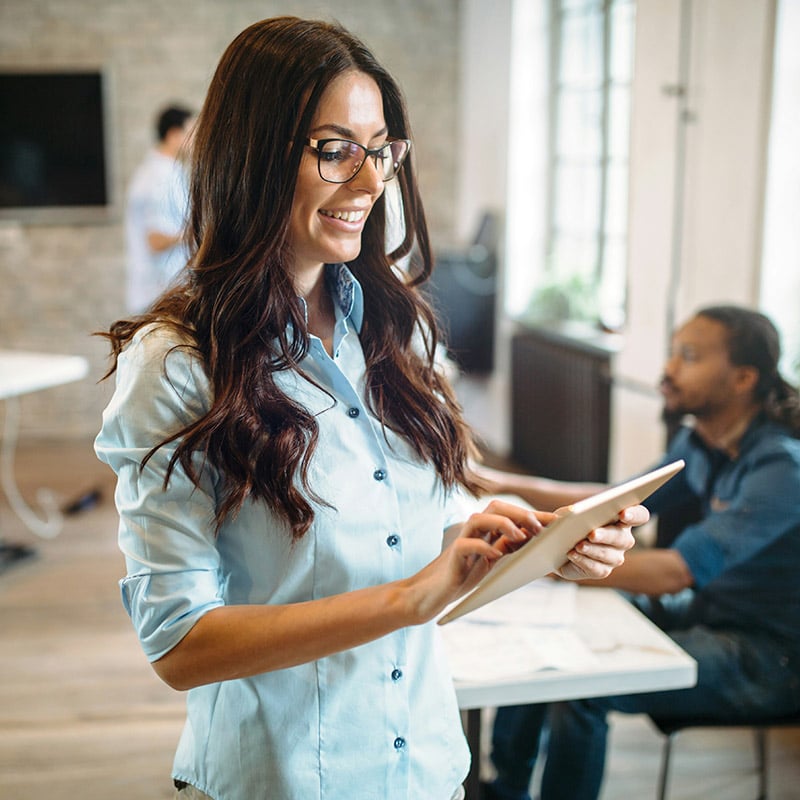 A female IT director witnessing the power of Defender’s AI and threat intelligence in action—detecting threats before they reach users and automating response across devices, apps, and identities.