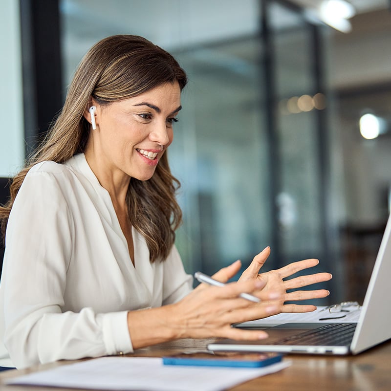 An employee benefits from her organization’s deployment of Microsoft Enterprise Mobility + Security through Microsoft Entra ID Governance and Entra ID Protection, which help strengthen access controls and reduce identity risk.