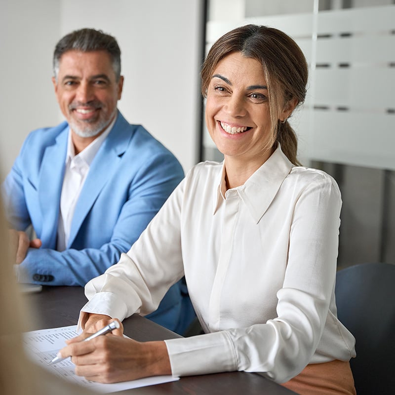 An employee taking a meeting benefits from the secure work environment created by Microsoft Enterprise Mobility + Security, which helps protect access, devices, and business data behind the scenes.