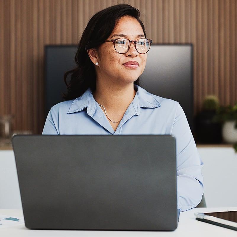 The employee works confidently knowing Microsoft Intune protects business data without limiting productivity.