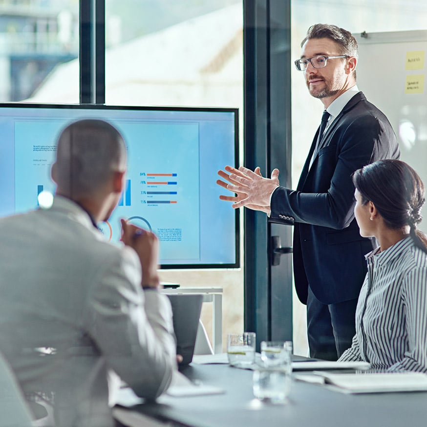 Mid-presentation to the board, the executive seamlessly shares insights using apps provisioned and kept current by Intune EAM.