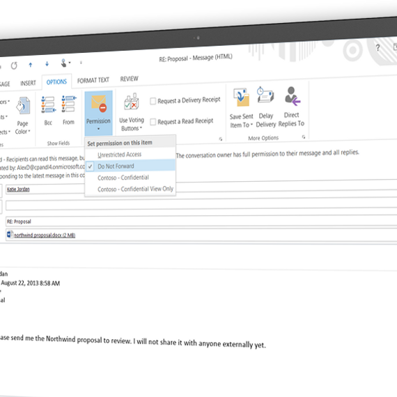 A user sits at their desk, typing into the Exchange Online search bar to quickly locate an important email thread, leveraging enhanced search capabilities for faster, more comprehensive results that save time and boost productivity.