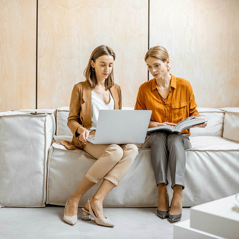Two IT team members use Purview Data Map to automatically discover, catalog, and manage data assets across both their cloud and on-prem environments—creating a searchable inventory that improves visibility and trust.