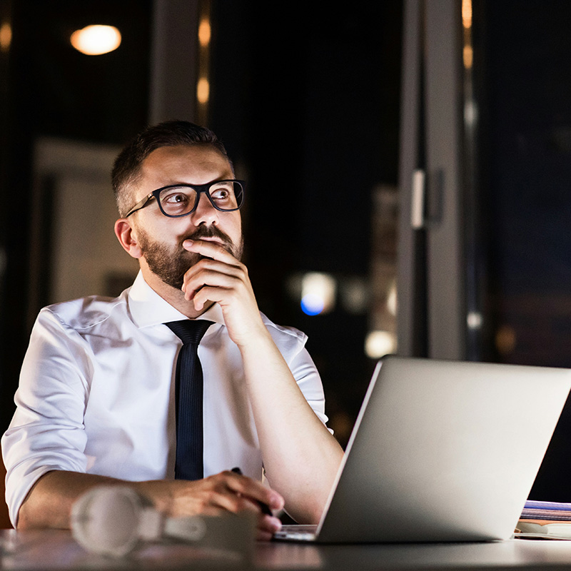 An IT security employee reviews a time-stamped activity trail in Microsoft Purview Audit, helping the team quickly understand what happened and when.