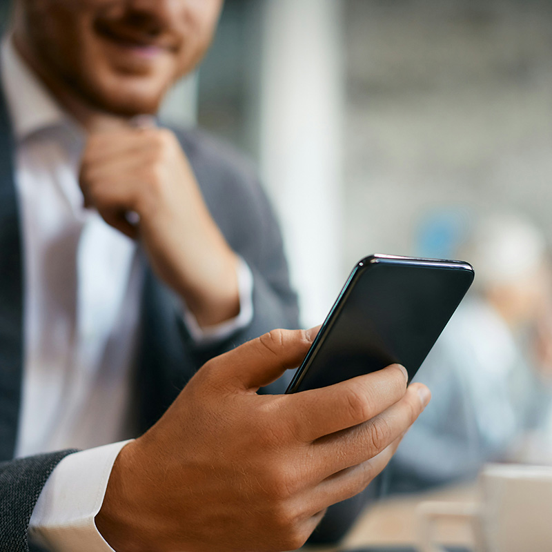 The employee uses Purview Compliance Manager to verify that mobile access policies are in place and enforced, helping the organization maintain secure use of BYOD devices.