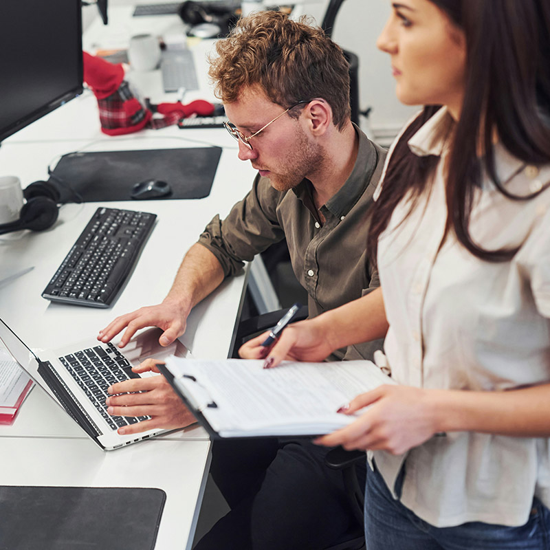 During a team meeting, IT staff review content flagged by Microsoft Purview’s sensitive information types to understand and manage data classification at scale.