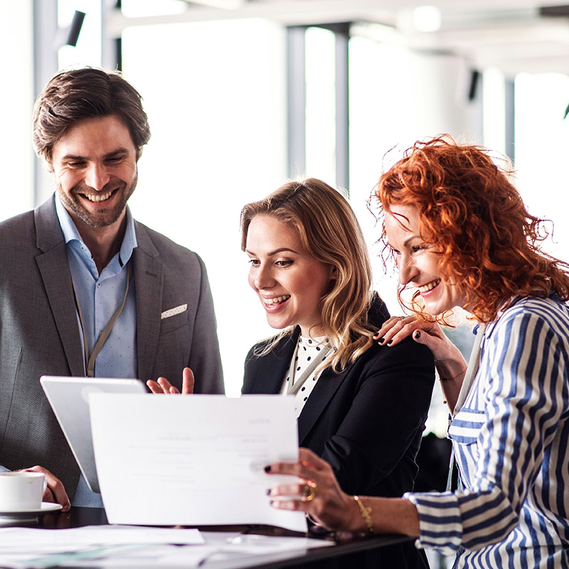 The same employee shows her team how Microsoft 365 apps integrate with Microsoft Purview to keep sensitive content consistently protected across workflows.