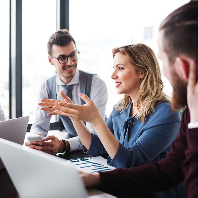 Legal, compliance, and HR leaders gather to review a case, using Purview eDiscovery’s shared tools to accelerate cross-department investigations and decision-making.