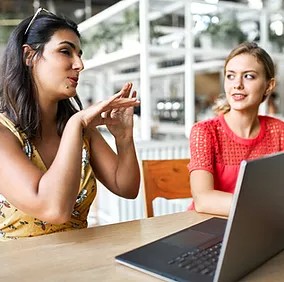 Coworkers using Microsoft Viva Goals to gain visibility into their goals by viewing and sharing their progress with each other