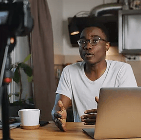 A female employee from the marketing director’s team actively engages in the meeting, contributing ideas and collaborating with colleagues as they strategize and plan upcoming first-quarter campaigns.