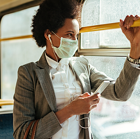 A female employee commuting to work on a bus securely accesses work applications on her mobile device, with Microsoft Entra conditional access dynamically enforcing security policies based on her location, device, and risk level to ensure seamless yet protected access to corporate resources.