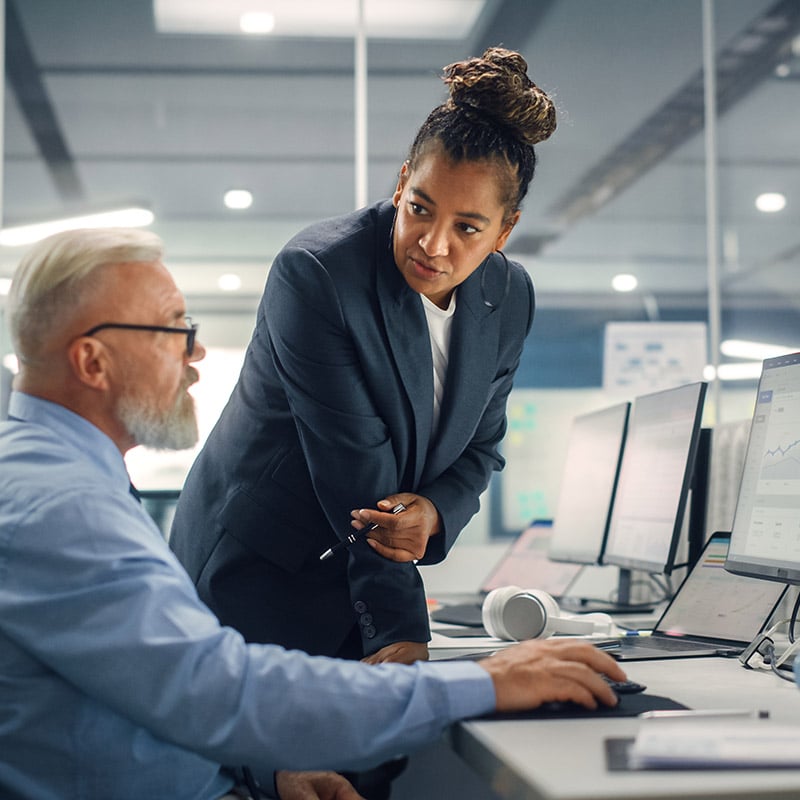 A male IT manager uses Windows 365 to simplify desktop delivery and management by provisioning Cloud PCs through a cloud-based model that is easier to deploy and oversee.