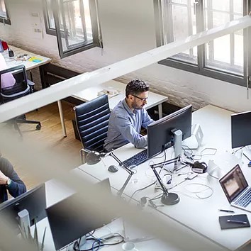 An IT security admin investigates a malicious file detected on an endpoint protected by Defender for Endpoint, using Microsoft Defender XDR’s advanced threat analytics to quickly assess and mitigate risks before they spread.