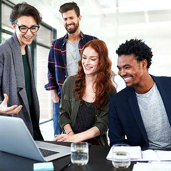 A female employee at an accounting firm shows her team her laptop, confident that Microsoft Defender for Office 365 safeguards their email communications from phishing and malware, ensuring client data remains secure.