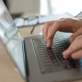 Picture of employee using Microsoft Teams in Microsoft 365 to meet, chat, call, and collaborate